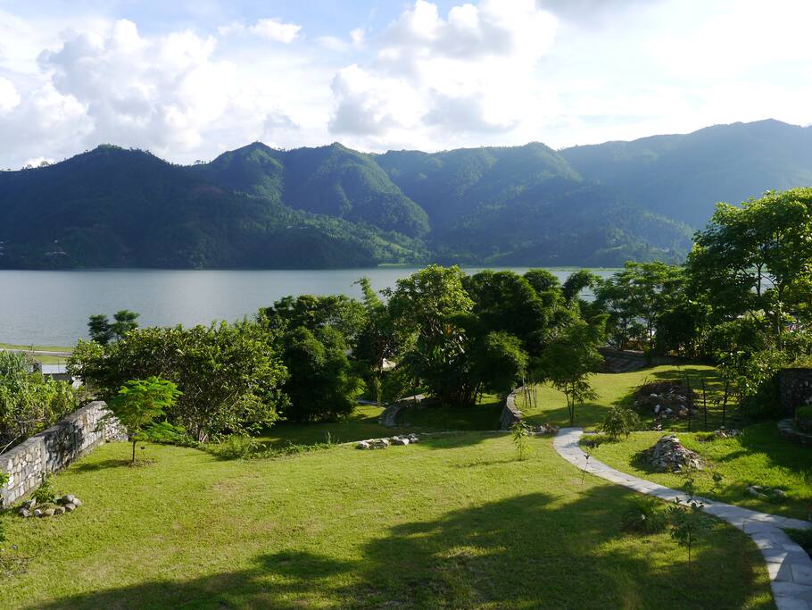 View from inside your living room overlooking your private garden and Lake Phéwa
