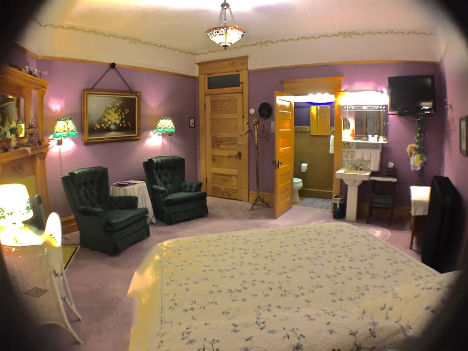 Lavender Room-Note view of bathroom, shower on one side and toilet on the other side, pedestal sink just outside of bathroom.