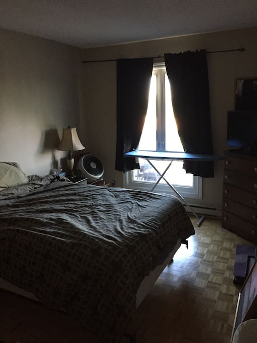 Bedroom 1, queen size, tv with Apple TV, view onto balcony