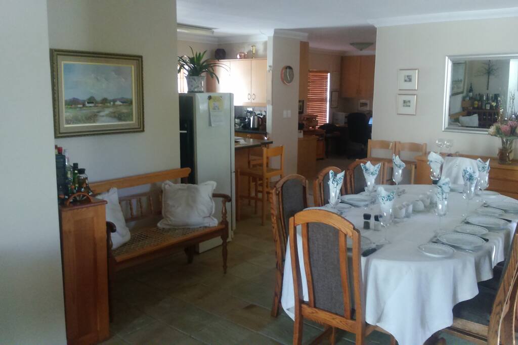 Dining room with kitchen on left and study in the background