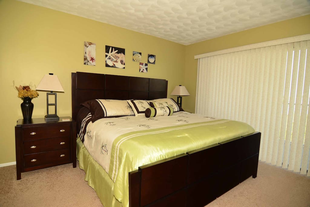 King size bed with flat screen tv, walk in closet and balcony