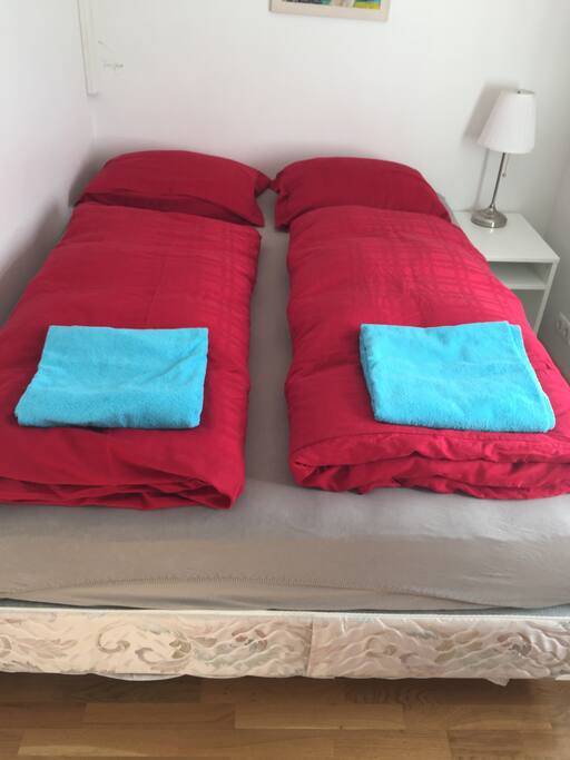 small room with queen bed