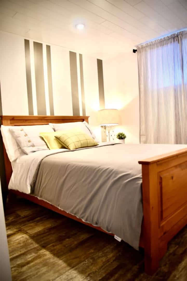 A comfortable double bedroom with a cozy, inviting feel — perfect for a restful night after a full day of exploring.