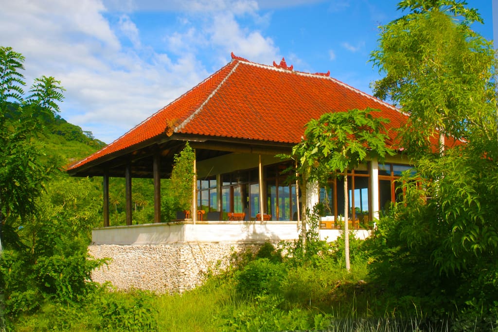 The Main House showing the veranda and Bukit Mundi in the background