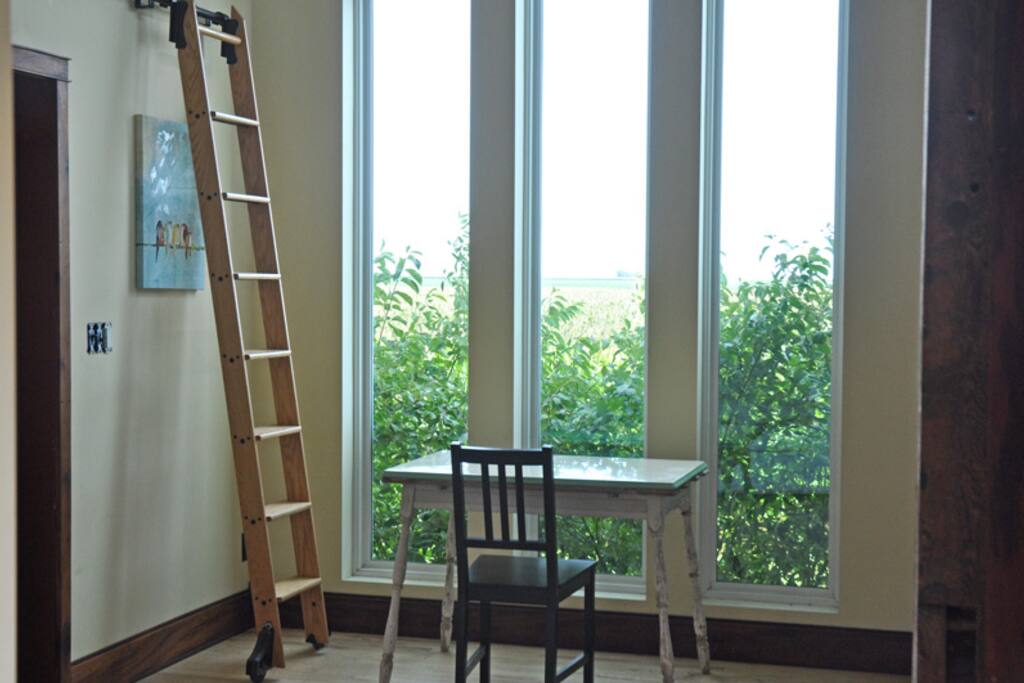 Floor to ceiling windows looking towards the sunrise.