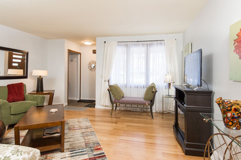 Living room is nicely decorated and comfortable. Kick back and relax after a long day of sight seeing or business meetings.