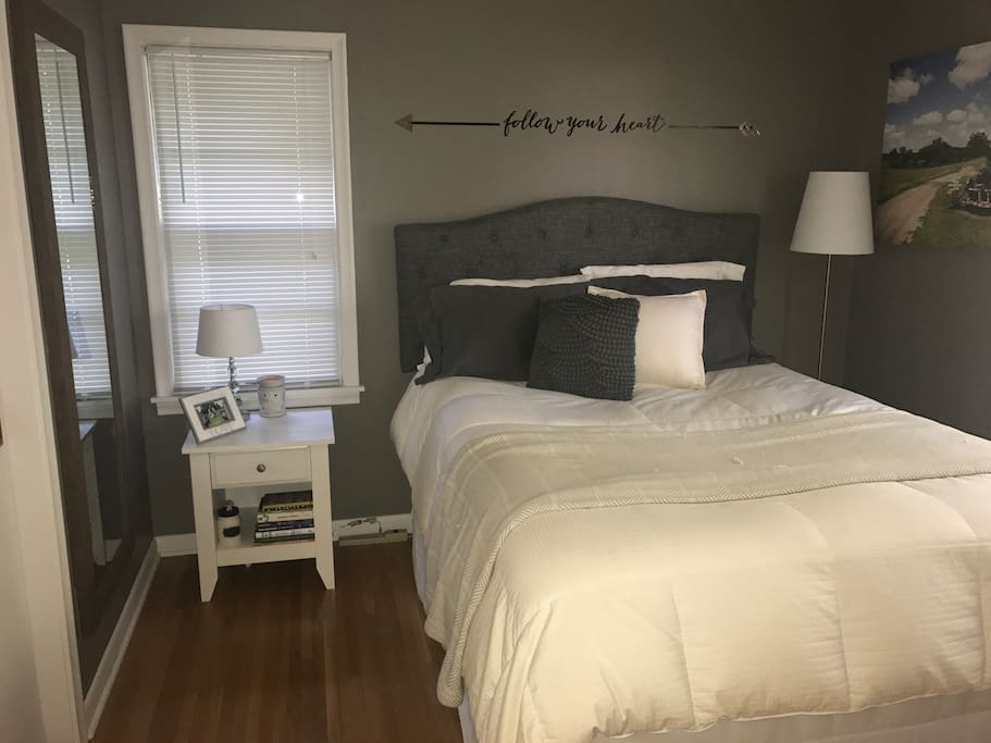 cozy master bedroom with queen bed