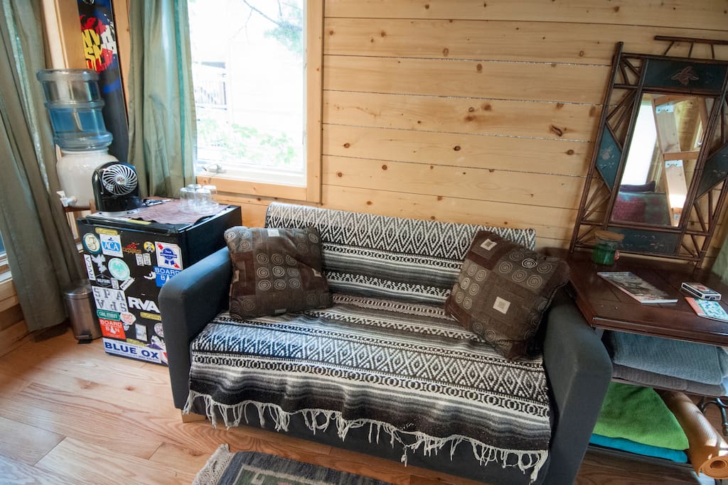 small couch and fridge