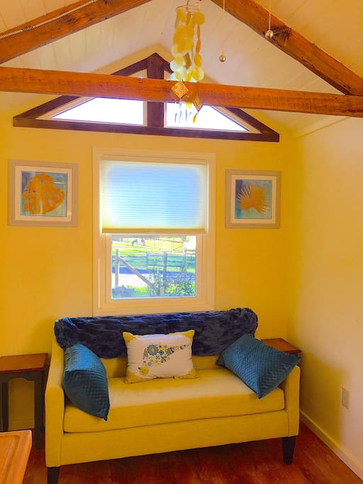 cozy settee w/ view to pasture & horses