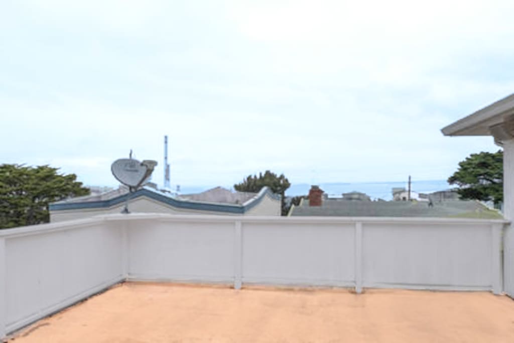 Large Private Deck with View of the Ocean in the distance.