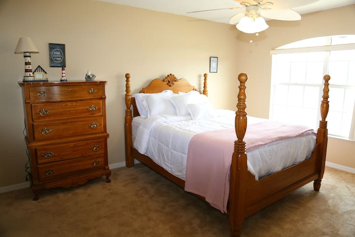This is the master bedroom with one queen size bed
