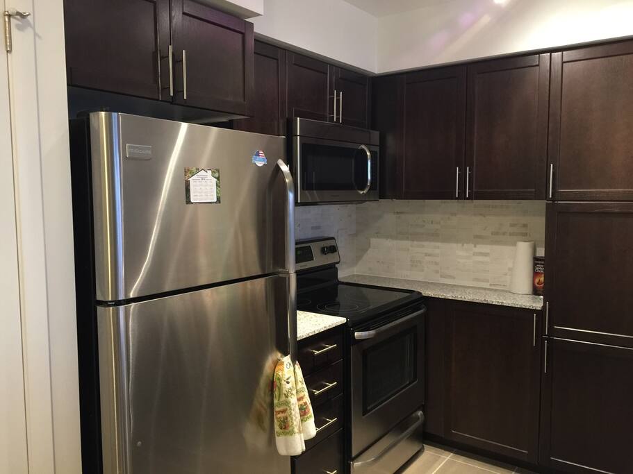 Brand new kitchen, ample of cabinet space and fridge space for groceries if you're planning on staying long term!