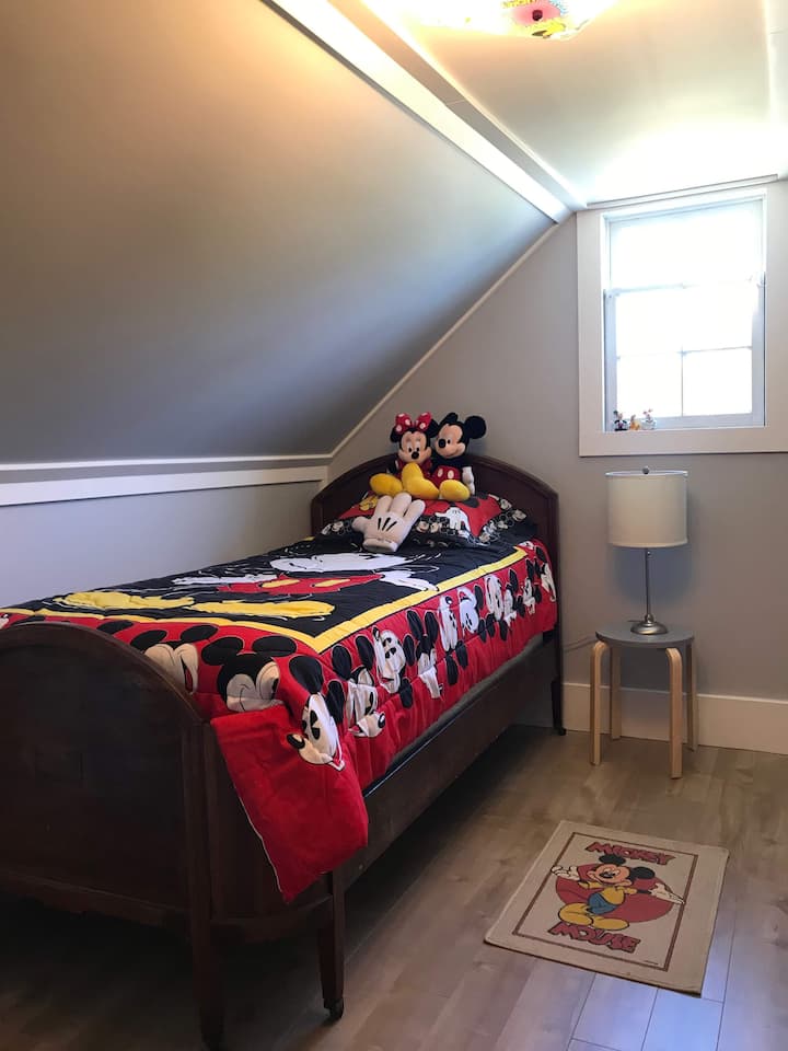 Bedroom 2 - Our Disney-themed nursery is perfect for the kids.