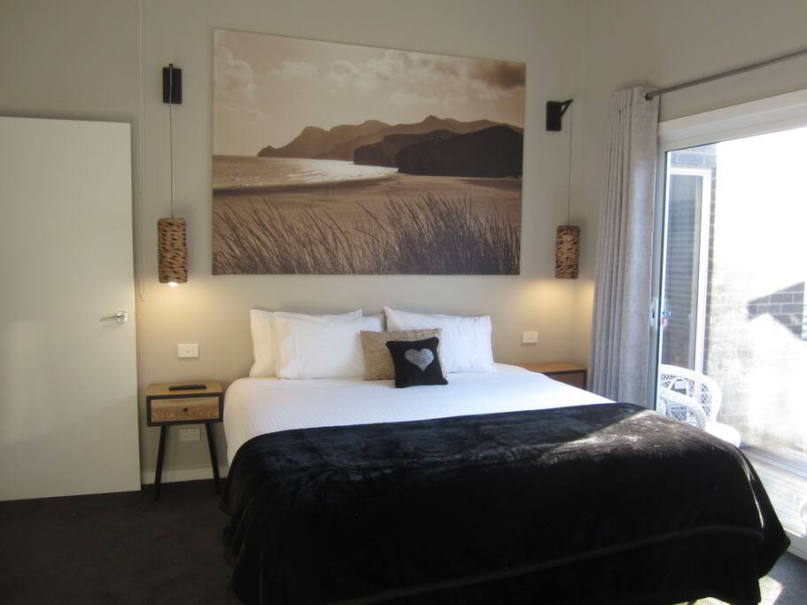 Master bedroom with King size bed opens onto private deck