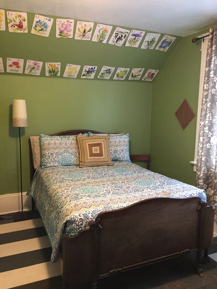 The first bedroom in the upstairs has a full sized bed with a fold down couch across from it. 