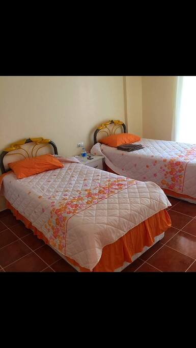 Bedroom with 2 pull out beds and balcony.