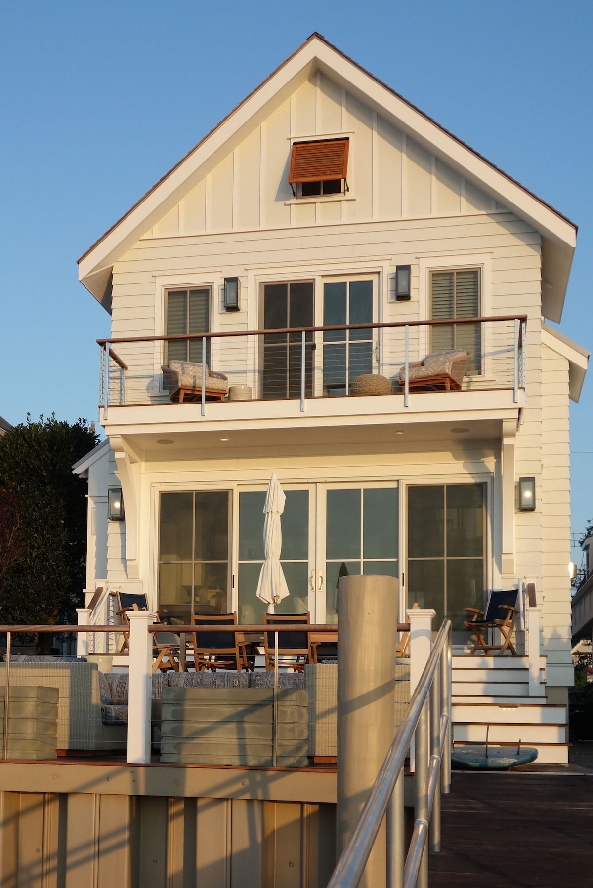 White and Wood Bayfront Beach Cottage with Docks - Cottages for Rent in ...