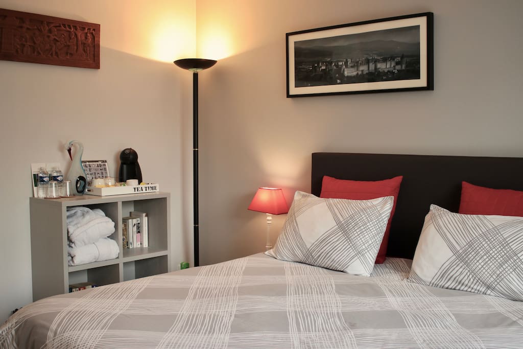Suite with complimentary set-up of Dolce Gusto coffee and tea, mineral water, bathrobes and books