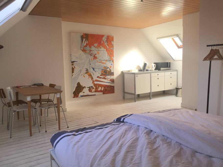 spacious room with clothing rack