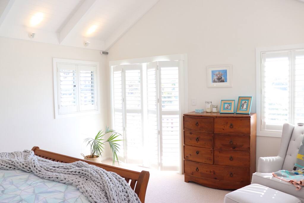 Bright and spacious master bedroom with king bed