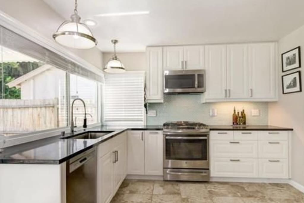 Fully upgraded kitchen with stainless steel appliances.