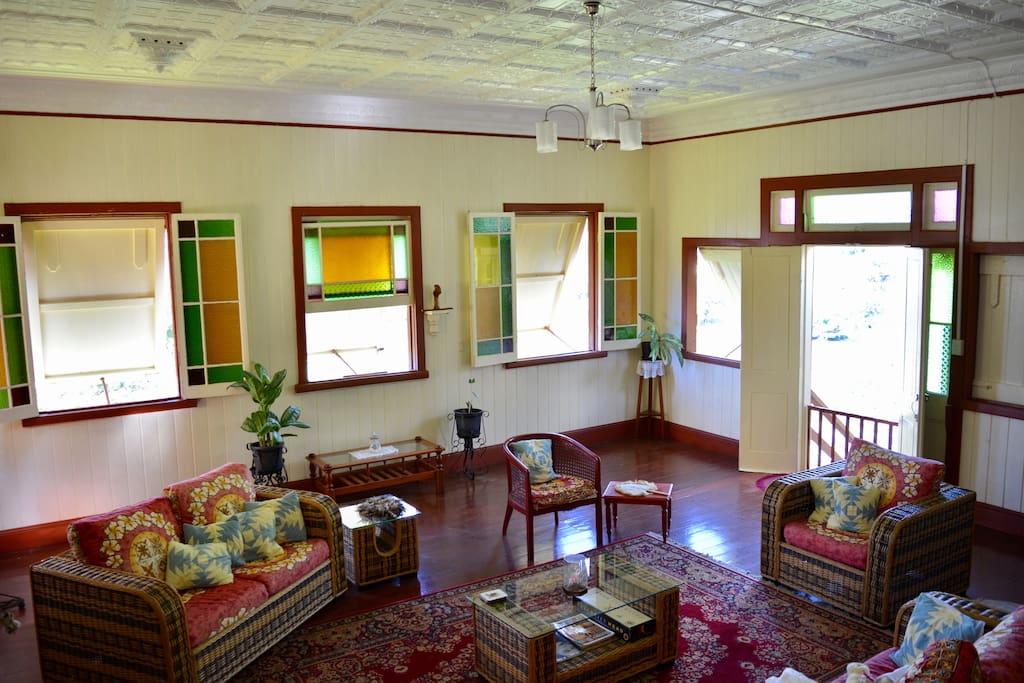 Living room with pressed ceilings and stained glass windows