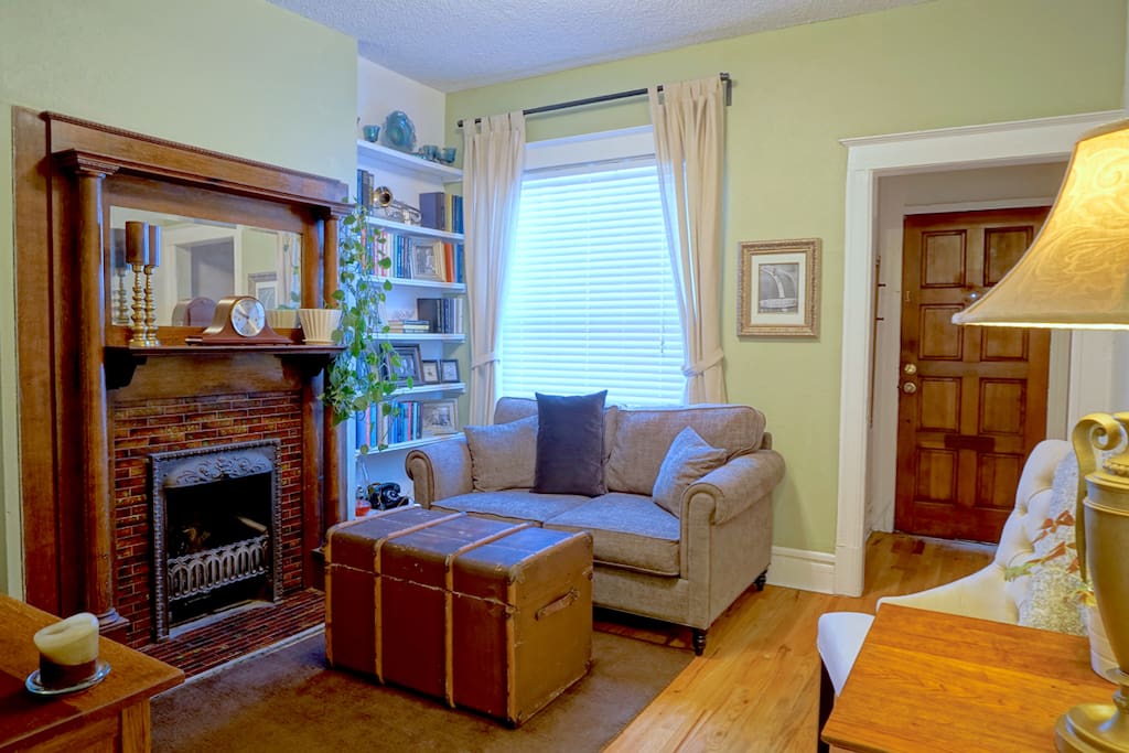 The living room has been expertly decorated with antique pieces to feel as though you have stepped into a 1940's home.