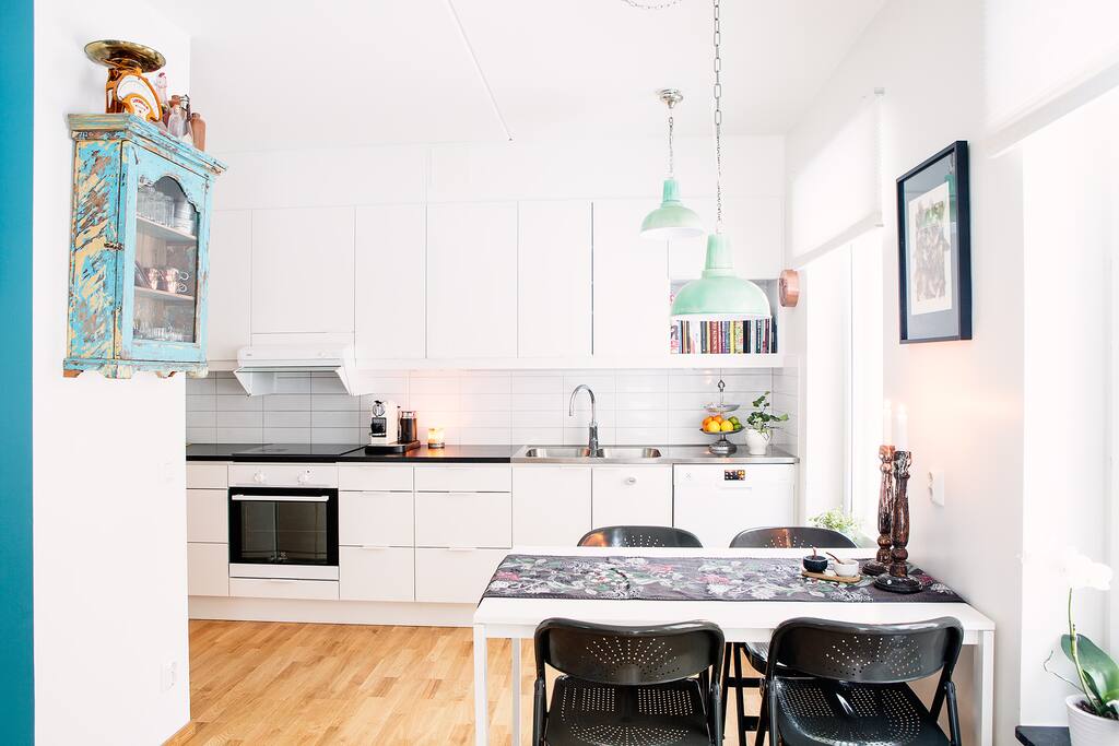 Modern, fully equipped, kitchen in open plan living area.