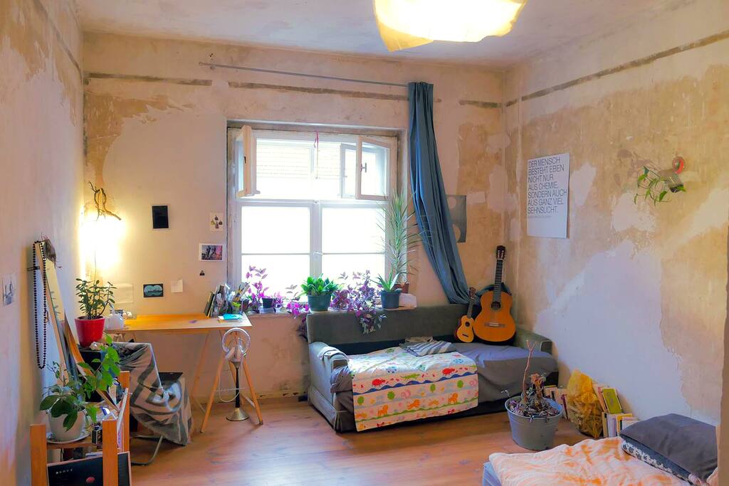 Cozy big size room for a couple. With also one big couch for a third person, confortable space and working desk. This is no big enterprize flat, but a humble true Berliner small home in a calm residential area.