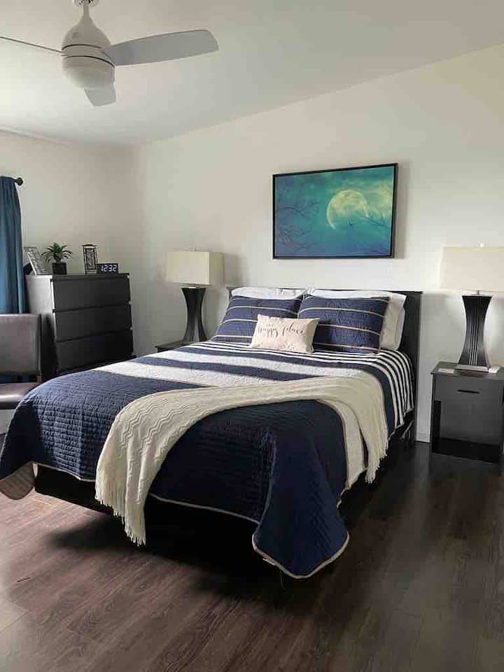 The home's master bedroom features luxurious linens with a queen size high end mattress offering a restful repose at the end of the day.