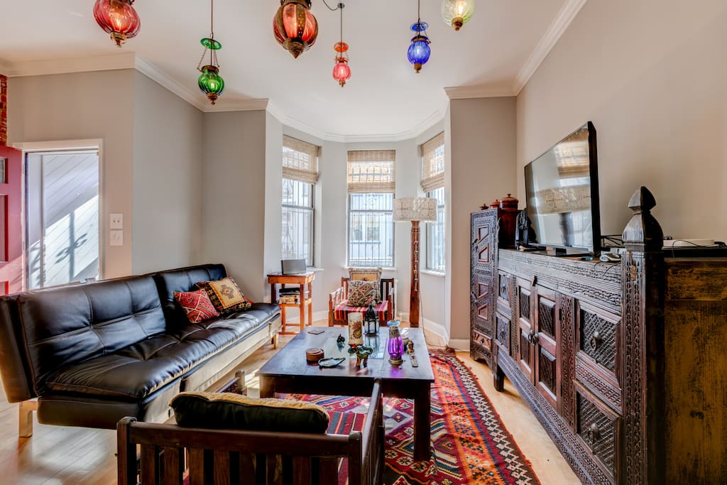 Sun Drenched Living Room and Entertainment Center W/ Smart TV