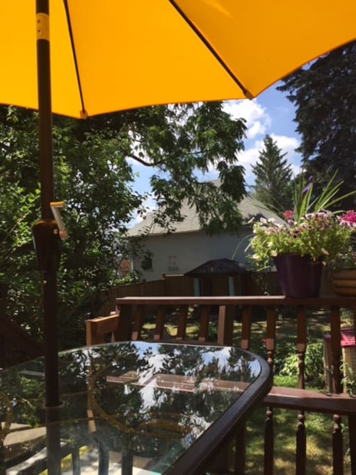 There is a beautiful large yard with a deck that seats 6 at the table. It is a great spot for morning coffee and for dinners at night.