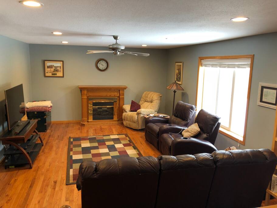 Main living room features an electric fireplace that is controlled by Alexa! Just ask her to “turn on the fireplace!”