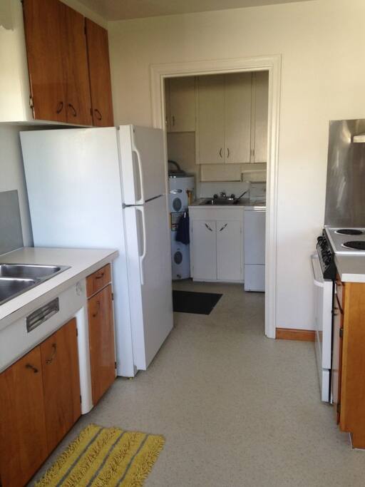view from kitchen to laundry machines