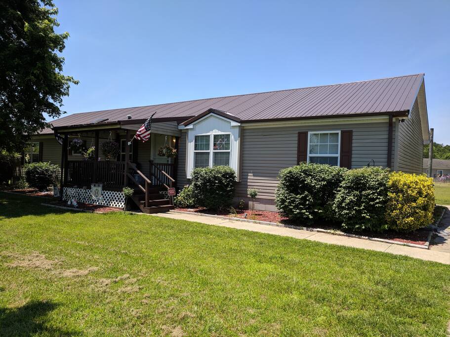 Paved Driveway, and Sidewalks. 4 steps to Enter.