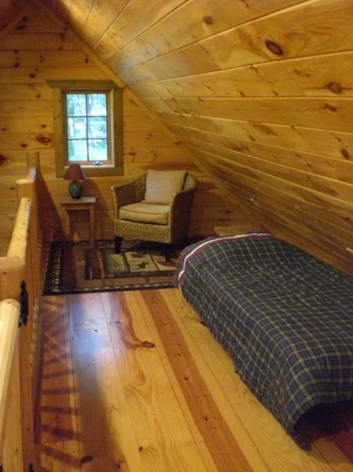 Loft sitting area with twin bed