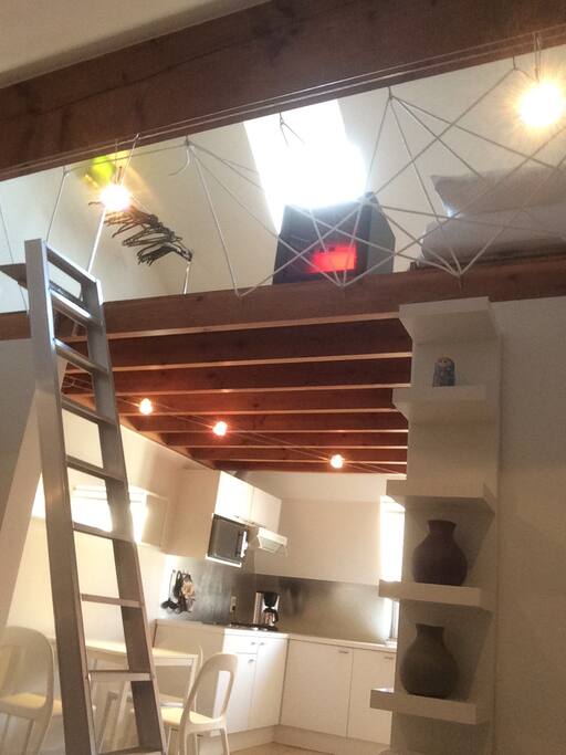 view to the kitchen and sleeping mezzanine