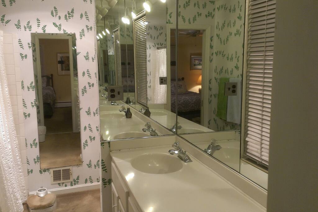 Private full master en suite bathroom with shower and dual sinks.
