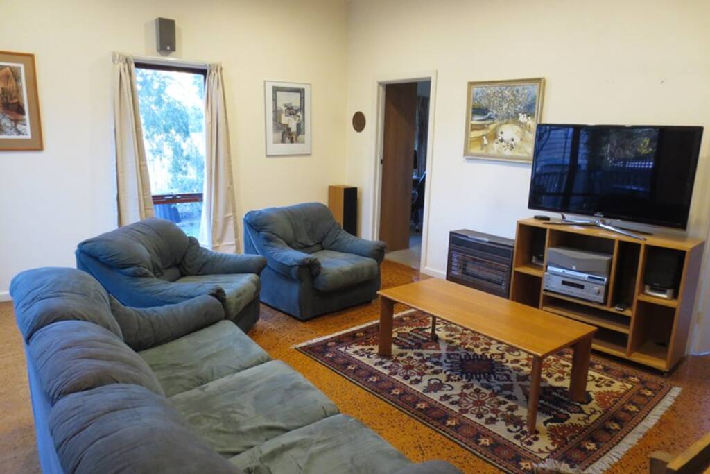 Bright spacious lounge leading to bedroom