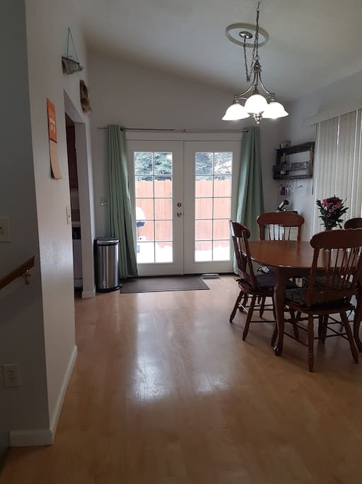 Dining Room - Table extends to sit 6. Doors lead to fenced in backyard and grill.