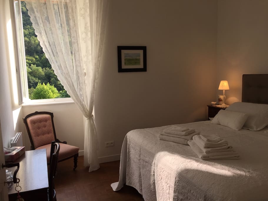 Romantic bedroom with super kingsize bed and Egyptian cotton bedding.