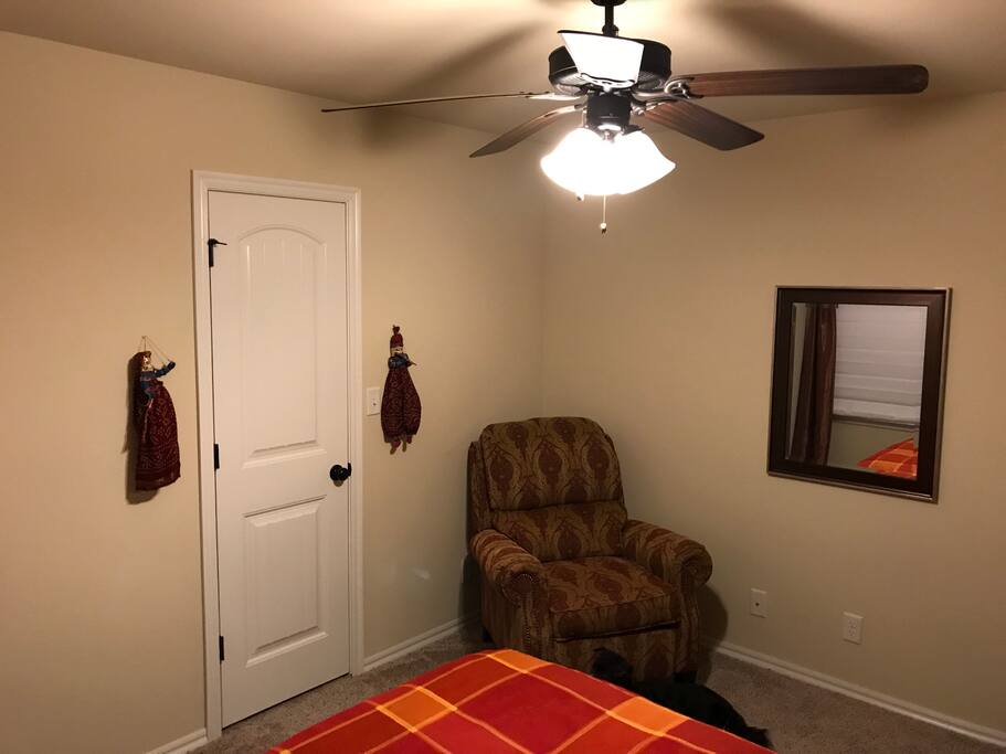 Bed Room view w/ Comfy Chair & Mirror.