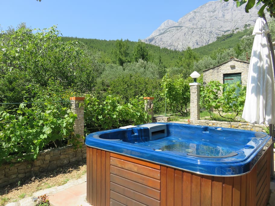 The outdoor whirlpool with a beautiful view of the mountain Biokovo