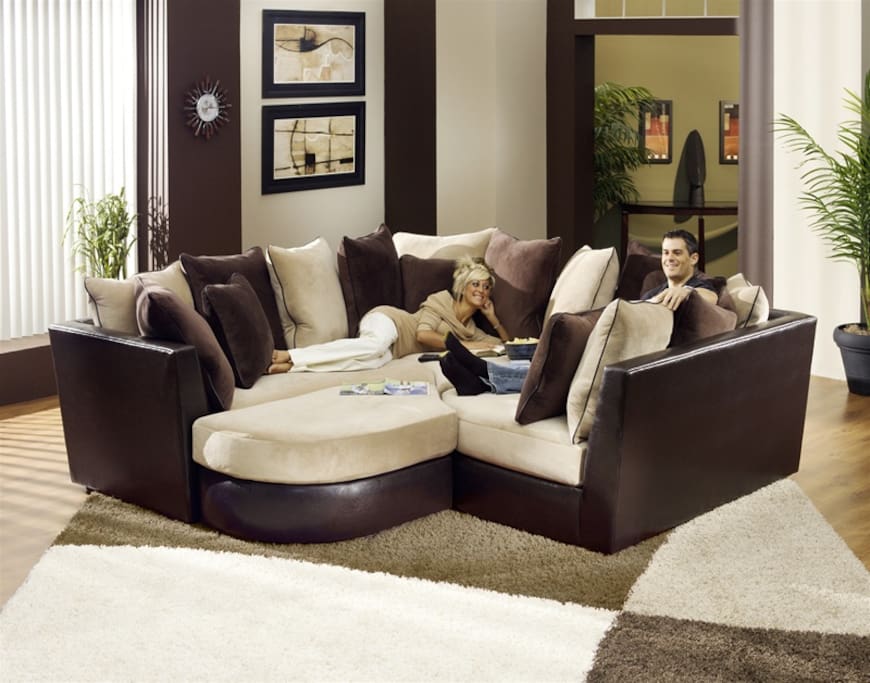 What our jigsaw couch set looks like when connected--turns into big bed. Linens provided