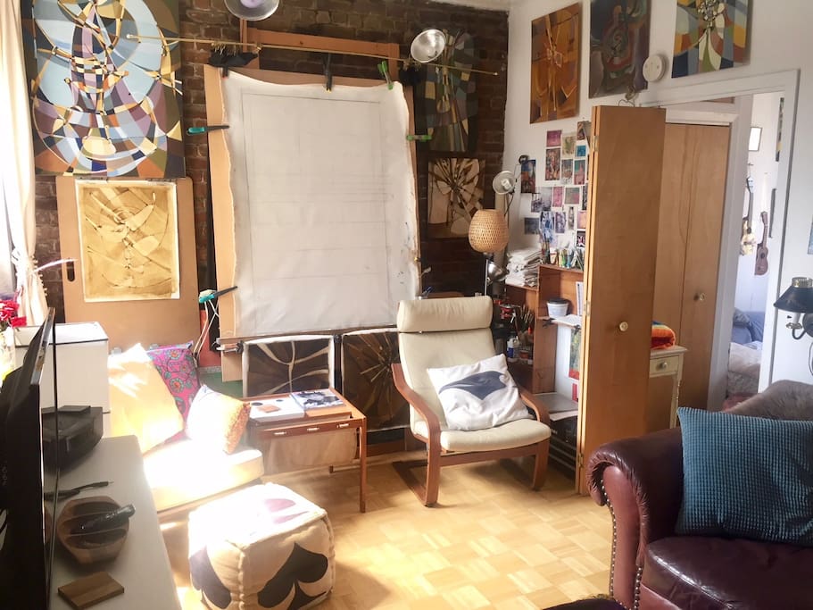 Cozy reading, listening, painting, social, creative space with Danish modern chairs an lots of interesting reading (art books, novels, history, magazines, etc.)