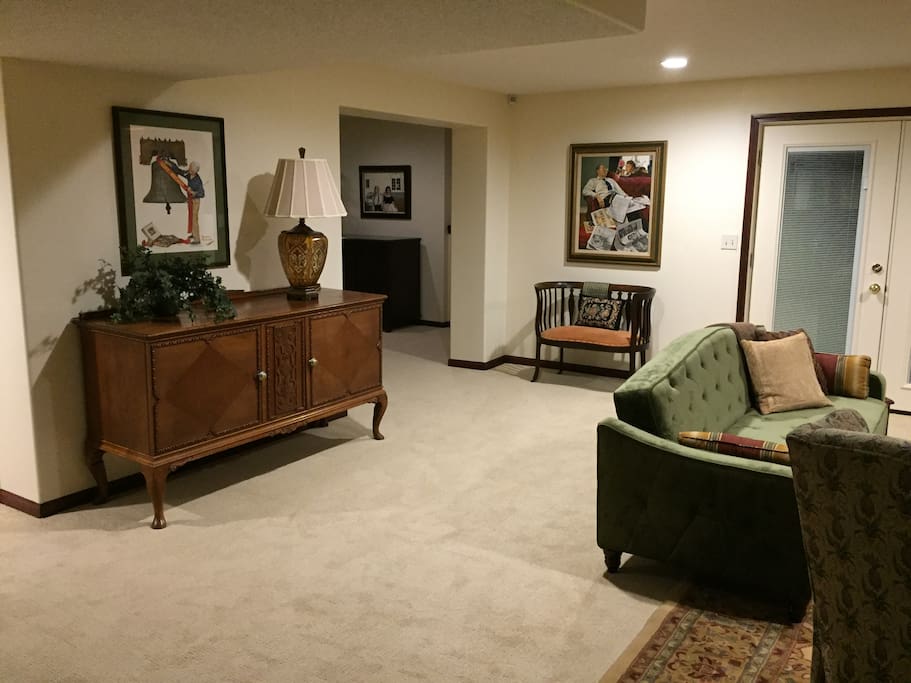 Living room with opening to pool room.
