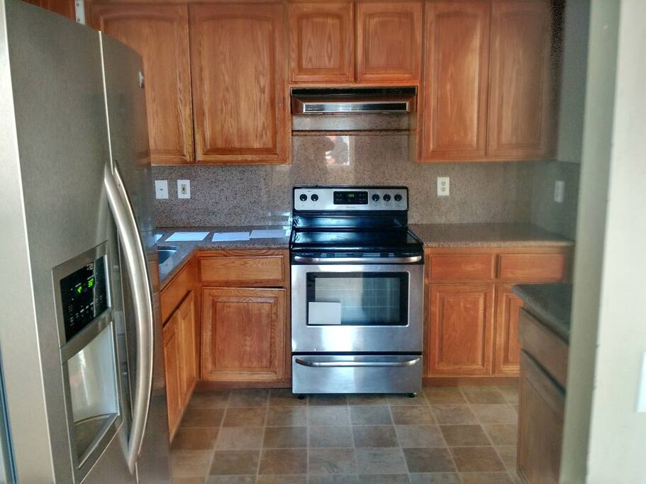Kitchen with stove, oven, fridge, and dishwasher, feel free to use.