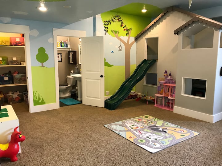 Playroom with bathroom and toy closet
