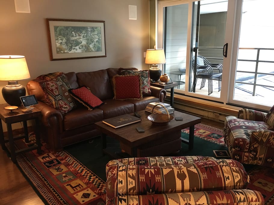 Living room with brand new queen size leather, sleeper sofa