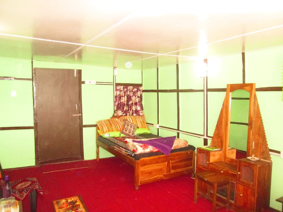 Bedroom with double bed and dresser